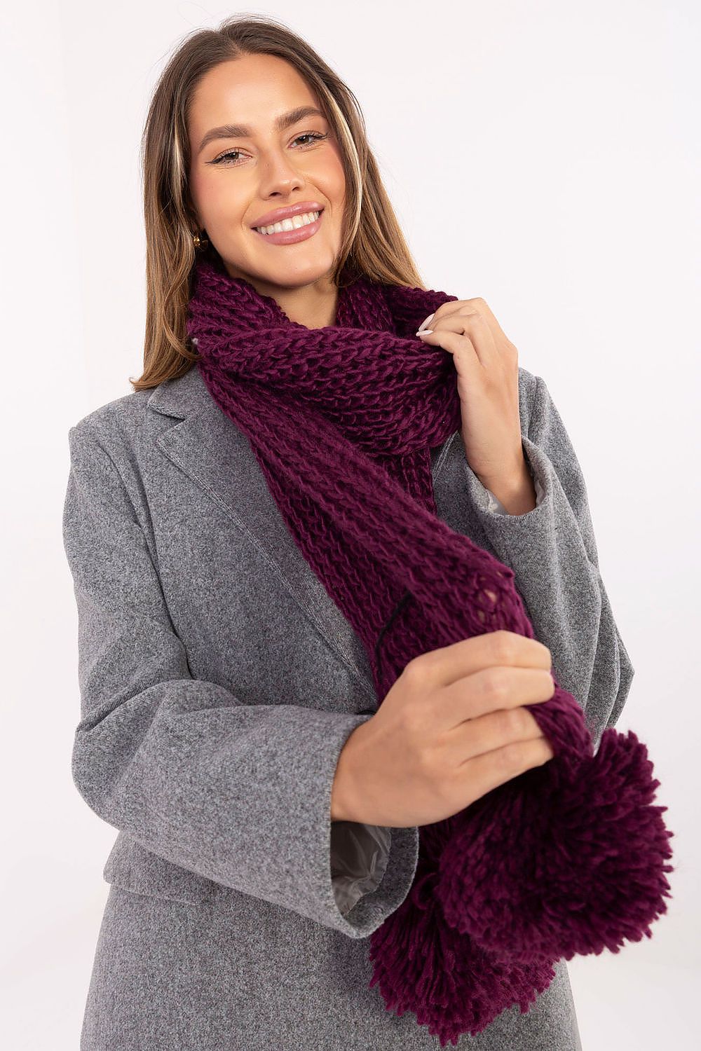 High-quality acrylic scarf by AT, featuring cute pompoms, ideal for adding elegance and warmth during winter.