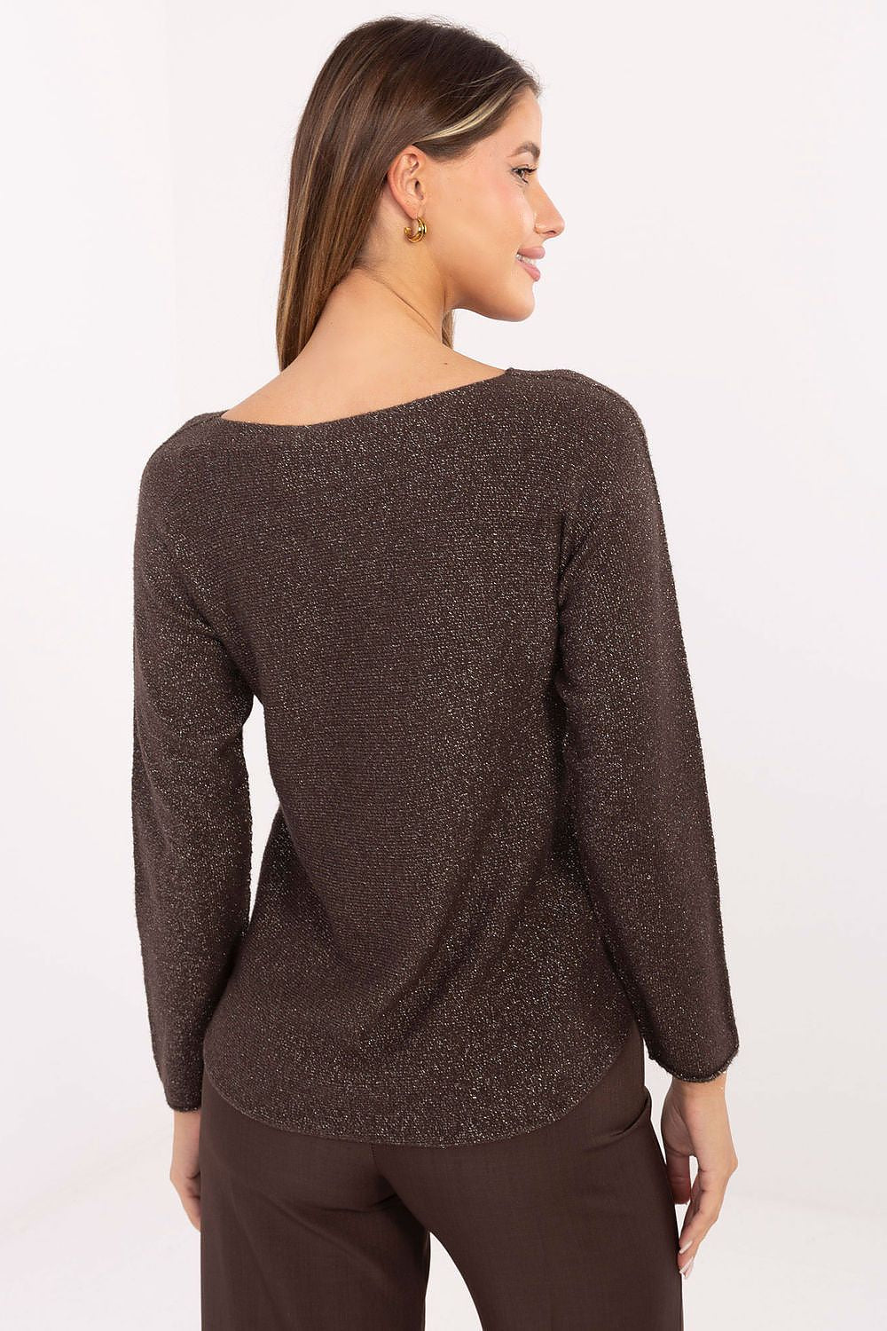 Model wearing elegant women's lurex sweater by Rue Paris, styled with trousers, illustrating versatility and sophistication suitable for both day and evening occasions.