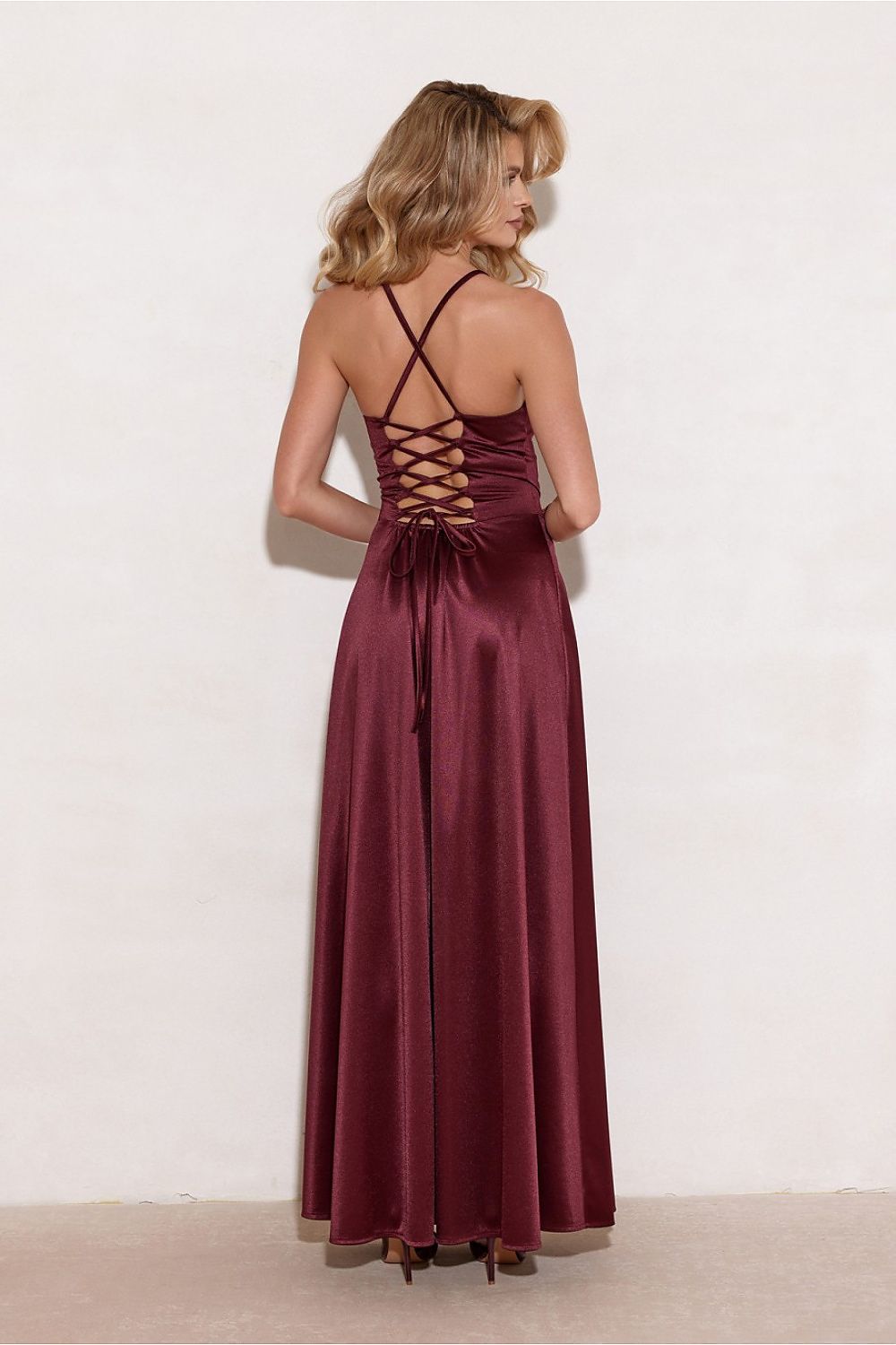 Back view of the luxurious flowy maxi dress from Roco Fashion, featuring decorative lacing for an adjustable fit and a subtle silhouette.