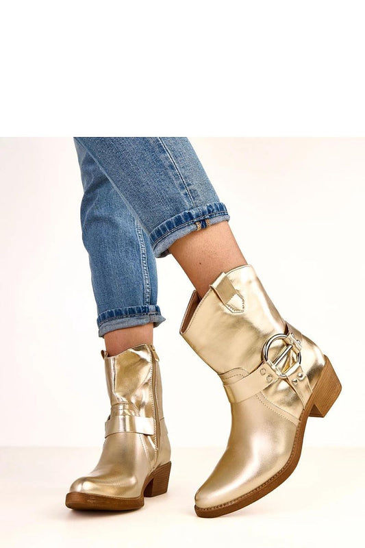 Elegant gold ankle boots by Solea featuring a decorative buckle, pointed toe, and 5 cm pillar heel, perfect for stylish autumn-winter looks.