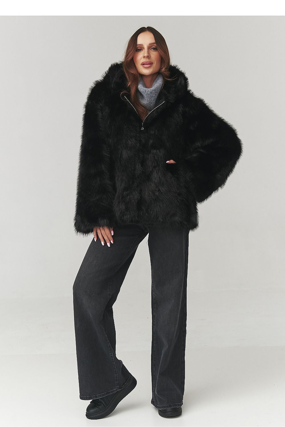 Detailed look at the hood of Makadamia's luxurious eco fur coat, highlighting the quality and sophisticated design.