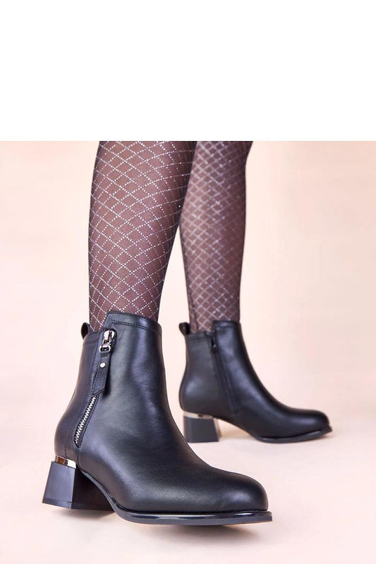 Stylish Solea black block heel ankle boots with a striking metallic insert, designed for women who value luxury and individuality.
