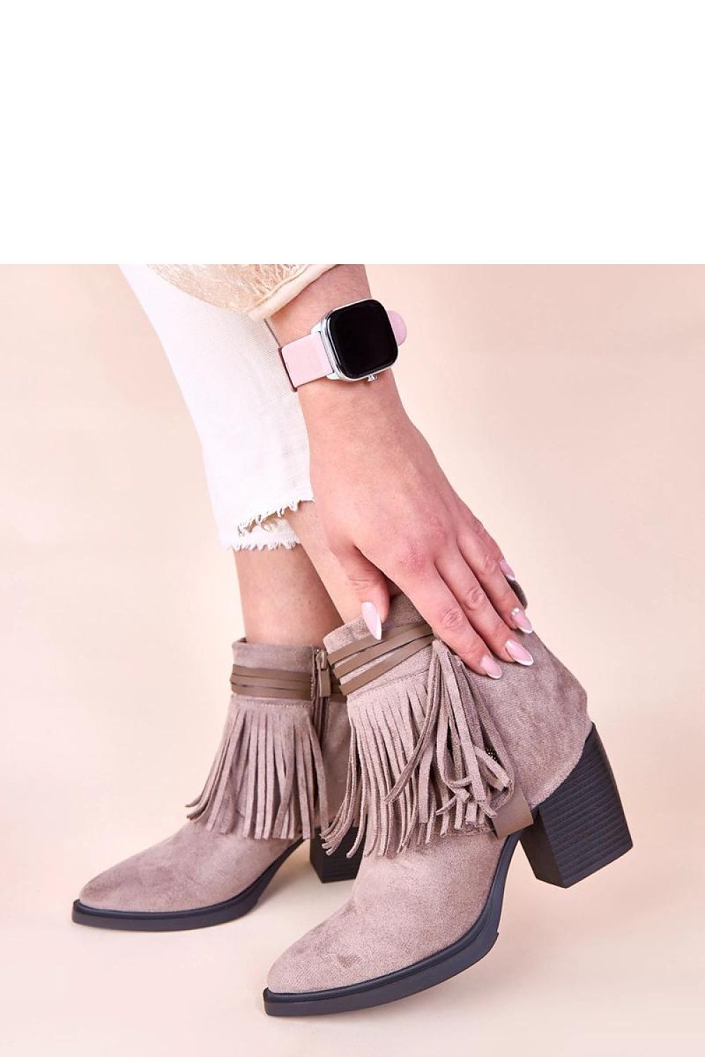 Fashion-forward black fringed ankle boots by Solea, demonstrating expert craftsmanship and attention to detail, making them a must-have for sophisticated wardrobes.