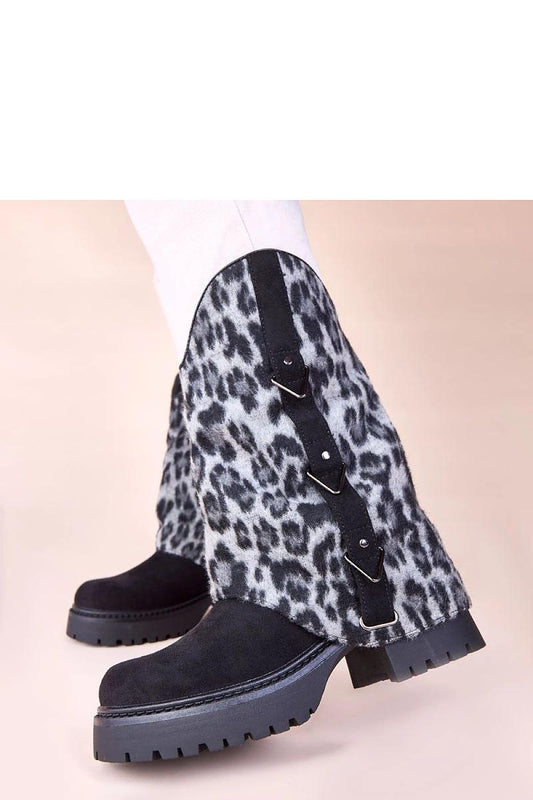 Close-up view of Solea Kaylia black ankle boots, highlighting high-quality craftsmanship and chic leopard print rolled shaft, ideal for fashionable women's footwear.