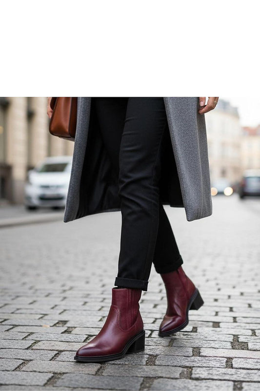 Close-up of Solea's high-quality artificial leather burgundy ankle boots, featuring a stylish elastic insert for comfort and elegance.