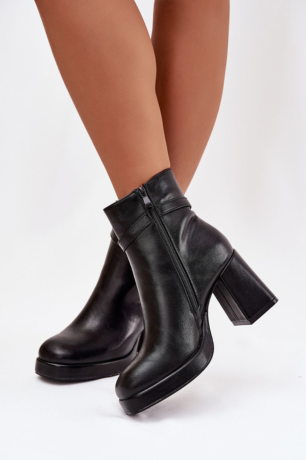 Chic eco leather ankle boots for women by Step in Style, showcasing a stable column heel, side zipper, and decorative strap for a refined look.