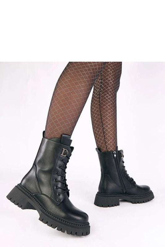 Close-up of Solea's luxurious platform ankle boots featuring dazzling zircon accents, designed for elegance and comfort, ideal for any fashionable outfit.