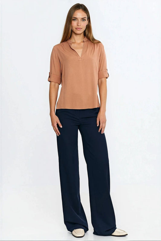 Close-up of Nife Viscose Blouse with adjustable cuffed sleeves, showcasing exquisite pleated details and lightweight fabric.