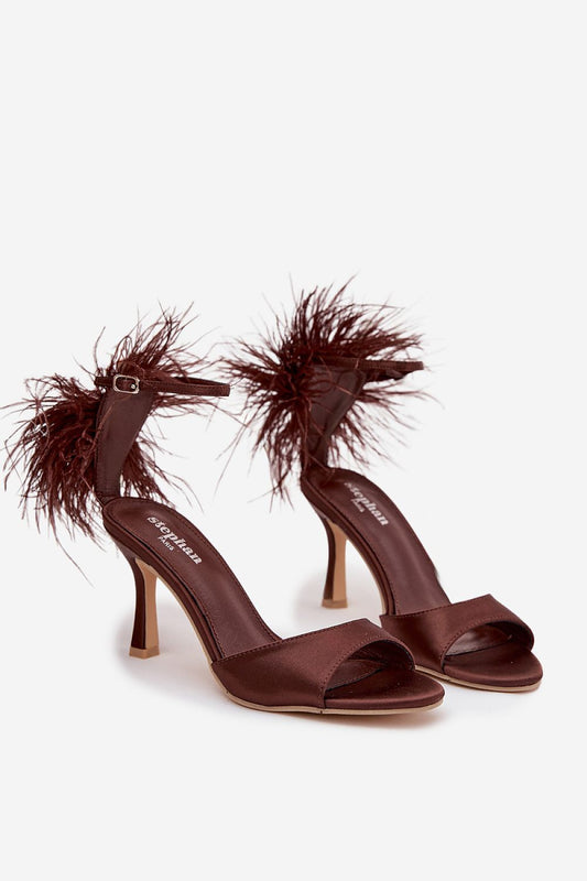 Elegant women's heel sandals by Step in Style, featuring decorative feathers and an ankle strap, perfect for special occasions.