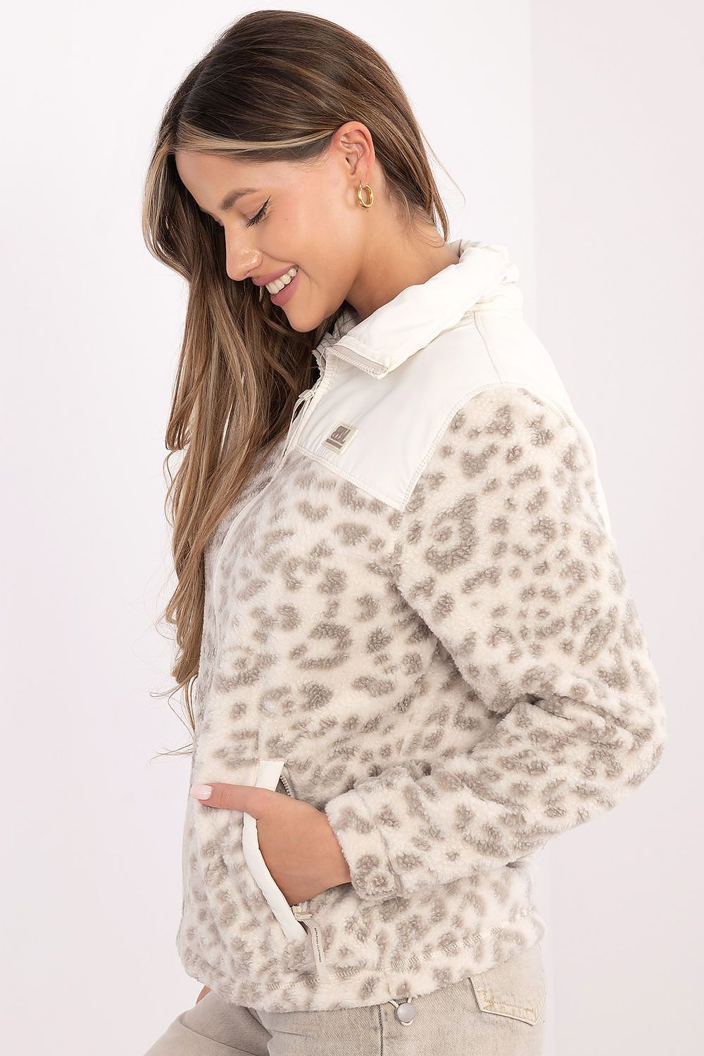 Close-up of Sublevel's sophisticated women's transitional jacket showcasing a stylish animal motif, detailed collar, and practical zip fastening.
