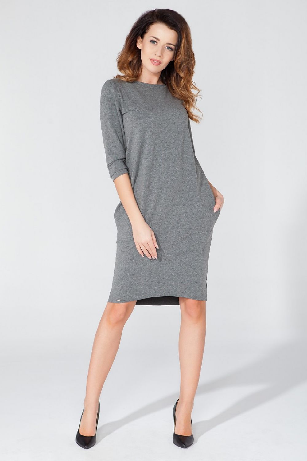 Close-up view of Tessita Elegant Knitted Daydress, featuring exquisite pocket detailing and a chic tuba cut design.