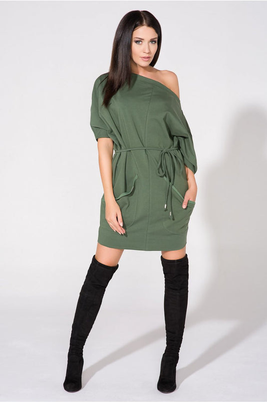 Elegant Tessita Loose-Fitting Knitted Daydress showcasing a stylish boat neckline and spacious front pockets, perfect for a chic, effortless look.