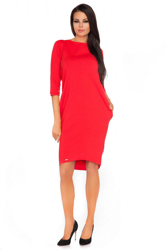 Close-up of the decorative bow straps on the Luxury Knitwear Daydress by Tessita, featuring pockets and ribbing details for a luxurious look.