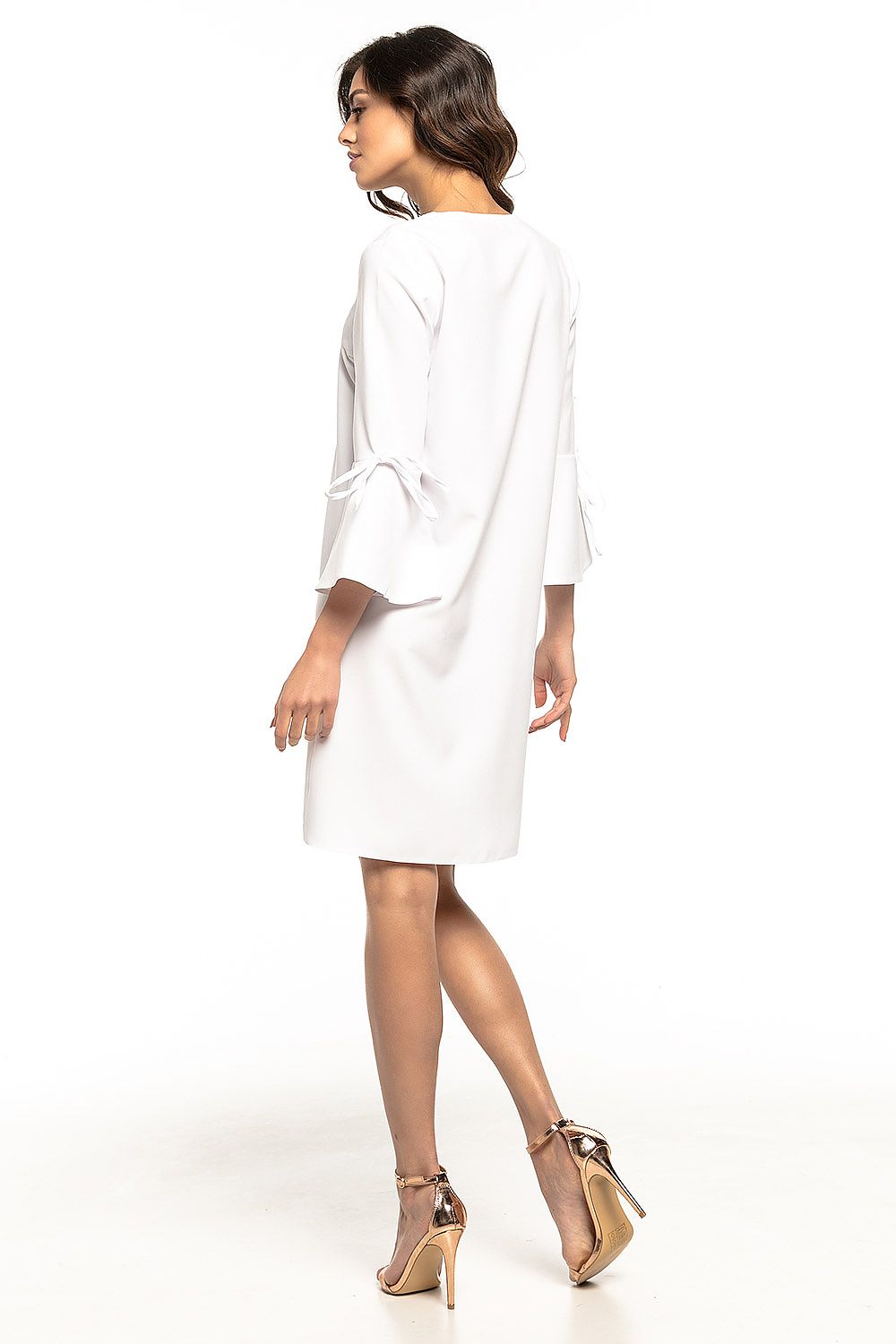 The luxurious fabric of Tessita's elegant loose V-neck cocktail dress, highlighting its beautiful frill sleeves and refined silhouette for a graceful look.