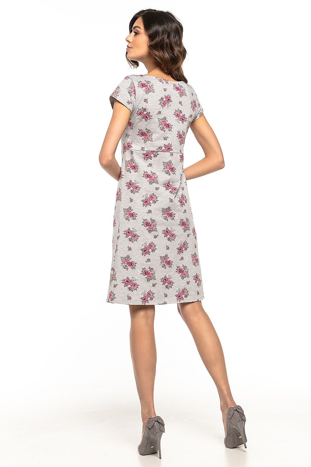 Elegant slightly trapezoidal floral cotton dress by Tessita, featuring a sophisticated white and black striped detail that enhances its luxury appeal, perfect for casual outings or holiday trips.