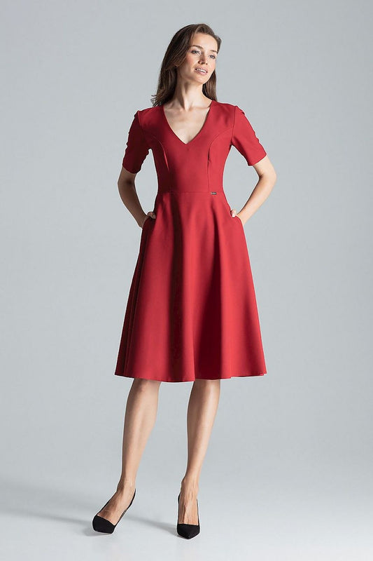 Sophisticated maroon midi dress by Figl, designed with short sleeves, a flared skirt, and discreet side pockets for a chic look.