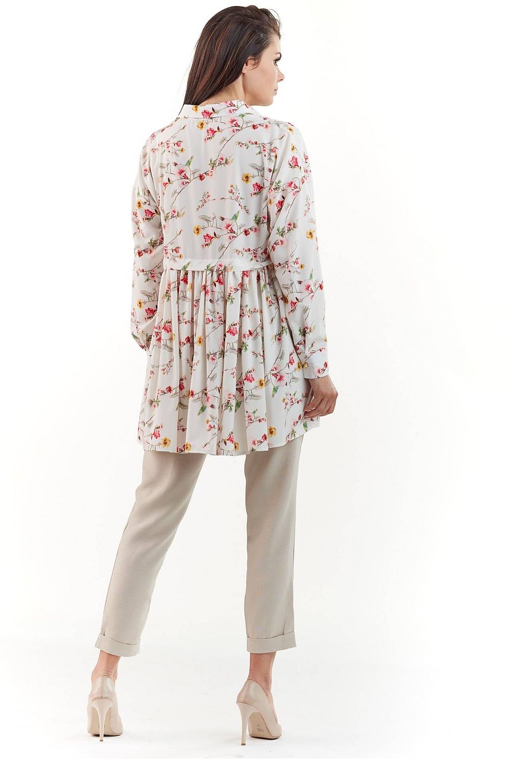 Elegant Long Sleeve Shirt with Charming Crease. The back detail of a model wearing a graceful floral patterned shirt, showcasing intricate design elements and paired with elegant trousers, epitomising chic fashion.
