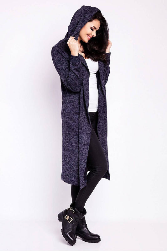 Model wearing the Luxury Long Loose-Fitting Cardigan With Hood and Pockets from Infinite You, featuring a chic, draped look with the hood up, paired with a white top and black leggings.