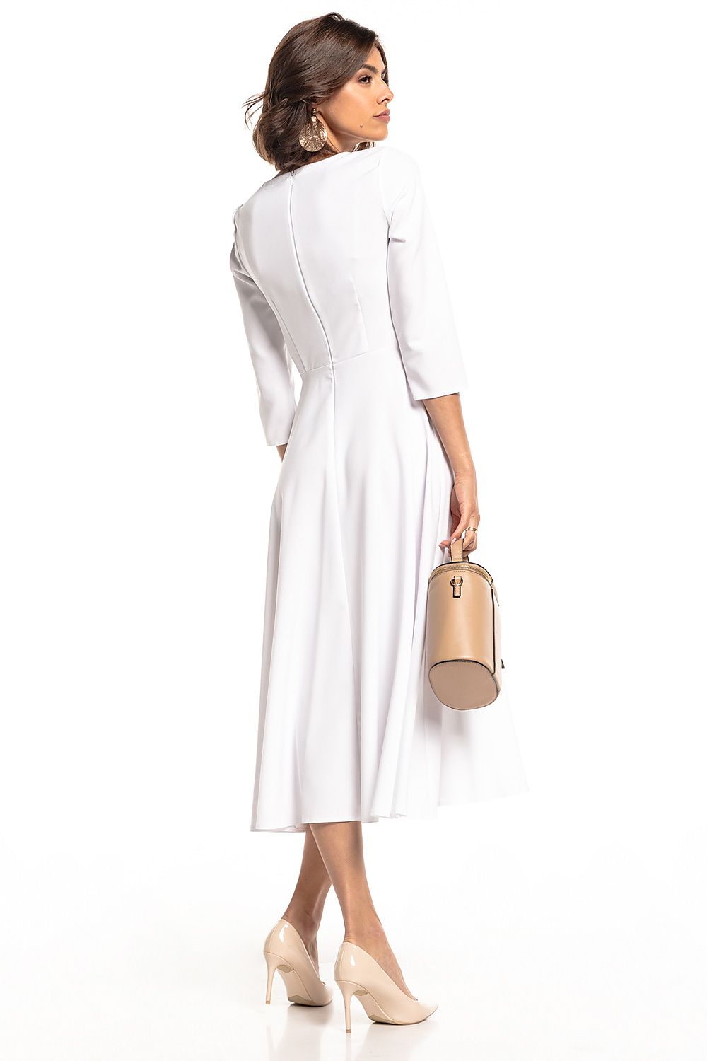 Graceful back view of the Tessita lightweight maxi dress in white, highlighting a tailored fit and exquisite craftsmanship, complemented by a chic handbag.