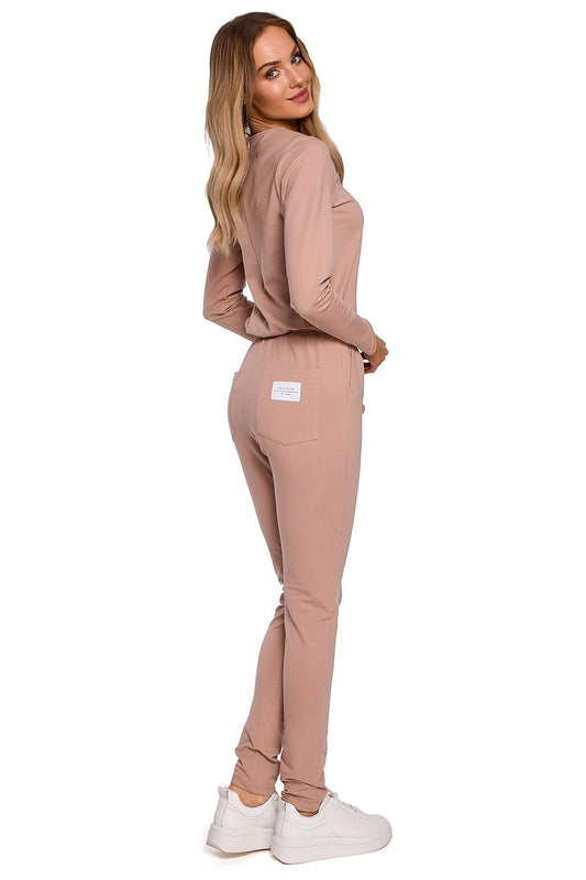 Back view of the Elegant Women's Fitted One-Piece Jumpsuit By Moe, featuring a sophisticated pink colour, adjustable waistband, and logo patch, ideal for a luxurious outfit.