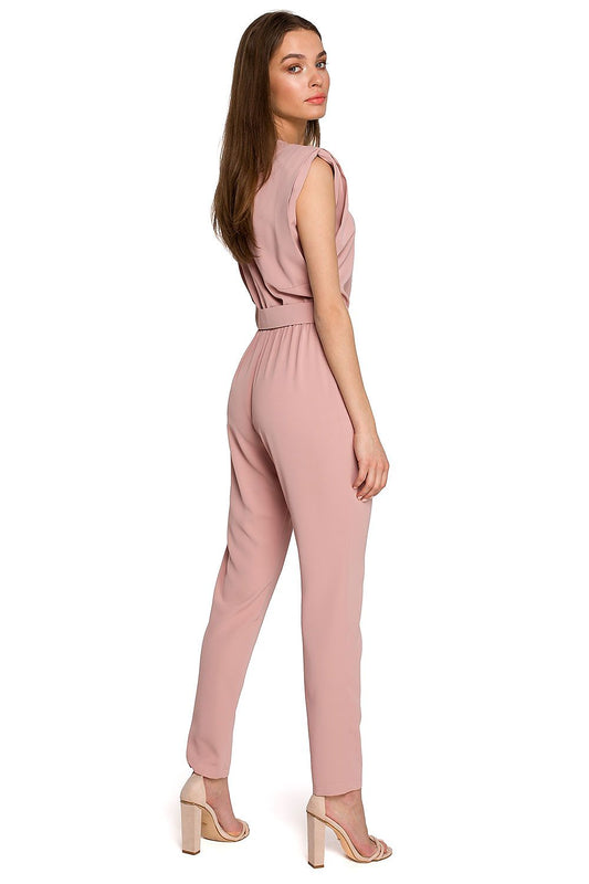 Stylish pink jumpsuit by Stylove, showcasing a loose fit, shoulder pads, and a belted waist at the back, ideal for fashionable outings.
