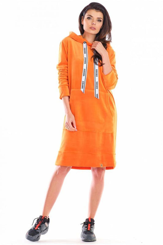 Sophisticated orange hooded velour dress by Awama, showcasing a practical front pocket and chic design, ideal for a refined yet comfortable look.