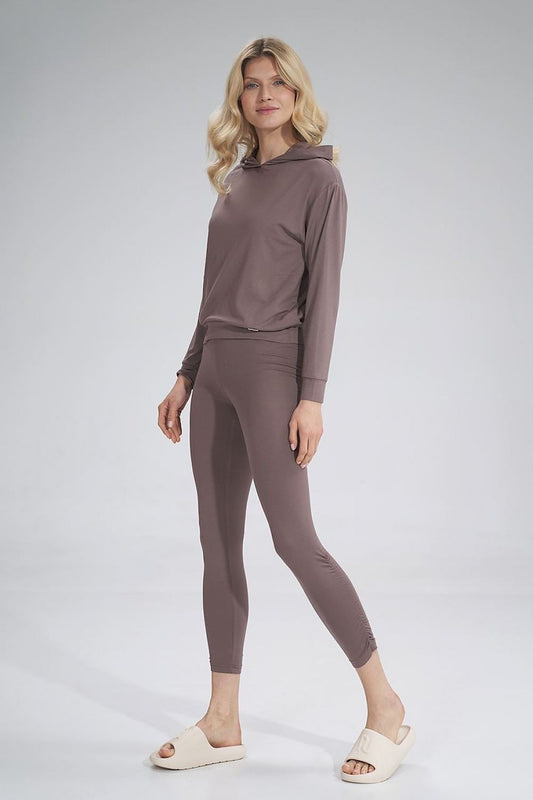 Stylish female model wearing the Luxurious Thin Viscose Hooded Sweatshirt by Figl with matching fitted leggings, exuding chic comfort and modern elegance.