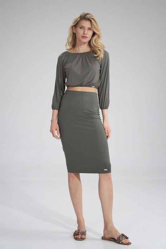 Elegant model showcasing a Figl cropped 3/4 sleeve pleated blouse paired with an olive pencil skirt, exuding sophistication.