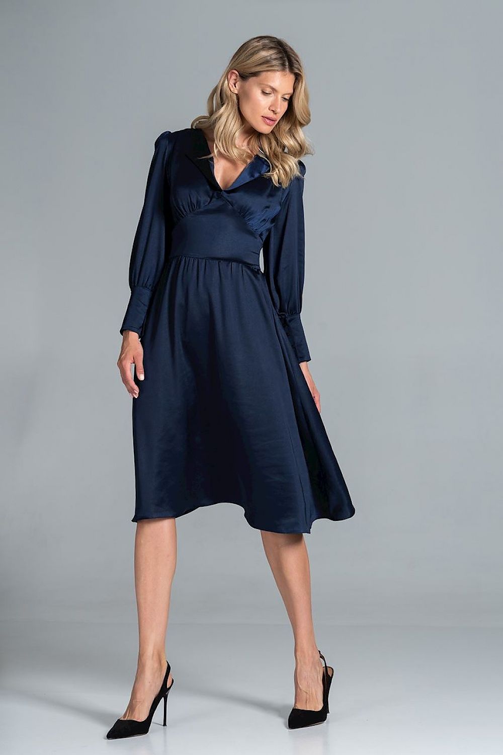 Elegant Midi Satin Dress with Heart Neckline, Buffet Sleeves, and Wide Belt by Figl, captured on a model in a dynamic pose, showcasing the dress's luxurious fabric and refined style.