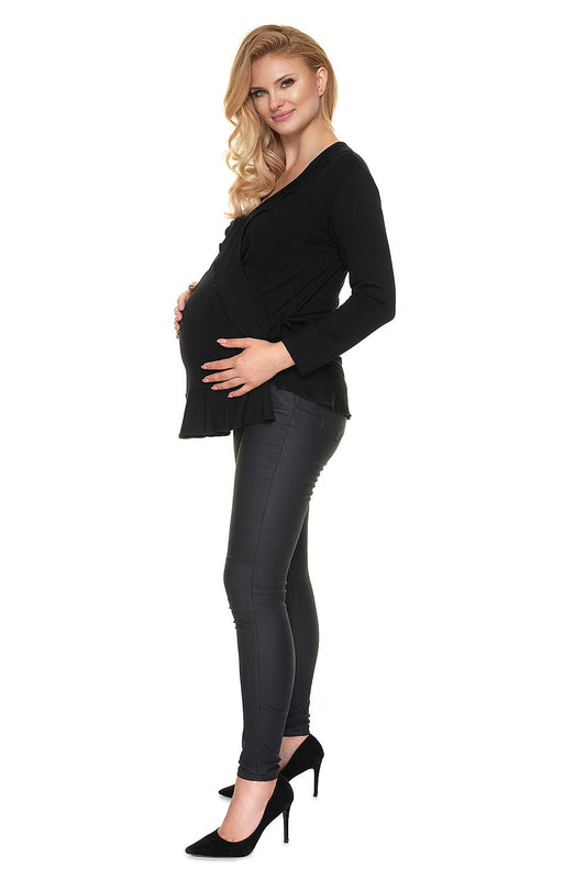 Sophisticated side view of a stylish maternity blouse with frills, perfect for expectant mothers. Model displays the versatile adjustable design of this pregnancy wear by PeeKaBoo, combining elegance with practicality.