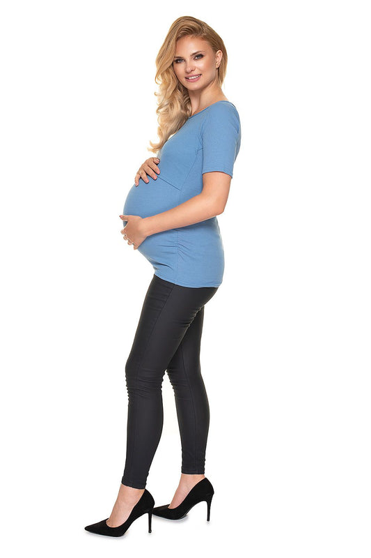 Side view of the Elegant Pregnancy Blouse with Pleats for Comfortable Nursing by PeeKaBoo Fashion. The model displays the blouse in blue, paired with sleek black leggings.