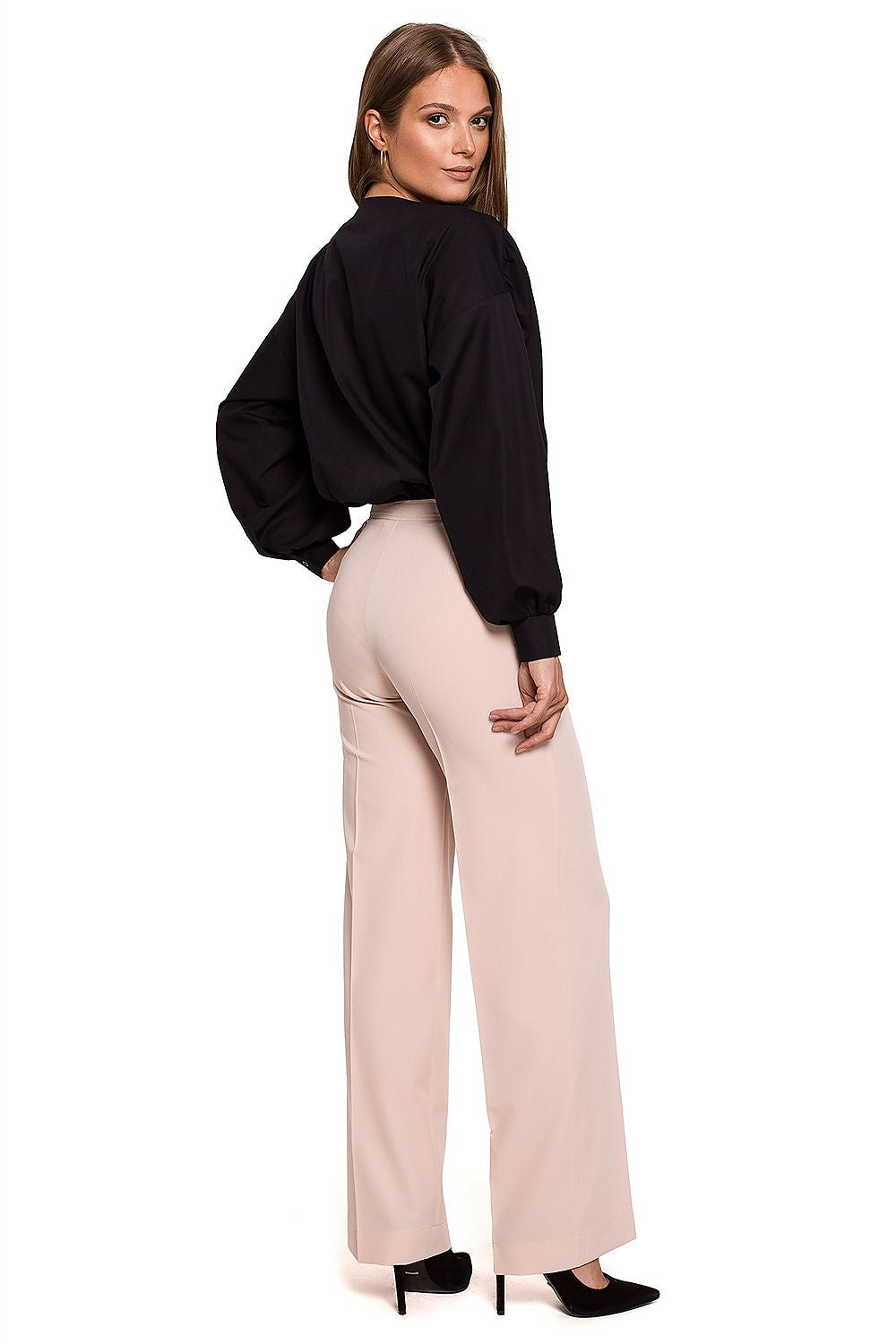 Rear view of the elegant straight leg trousers by Makover, complemented by a stylish black blouse, perfect for an upscale business environment.