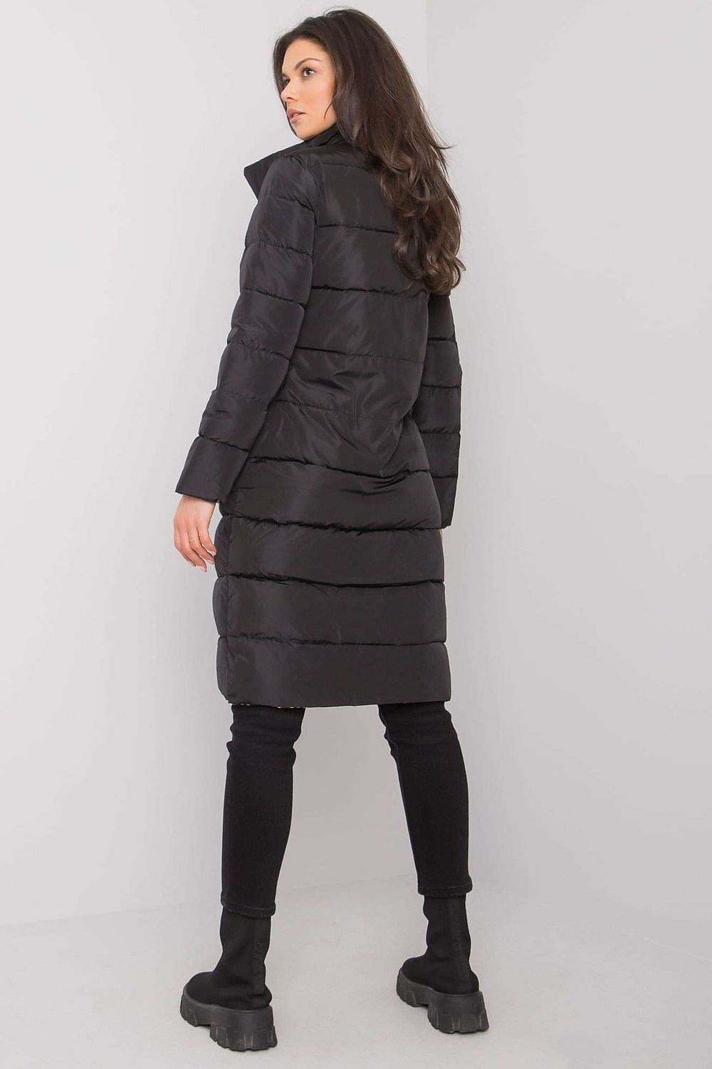 Back view of Yups women’s luxury black quilted winter coat, highlighting its sophisticated silhouette and premium quality.