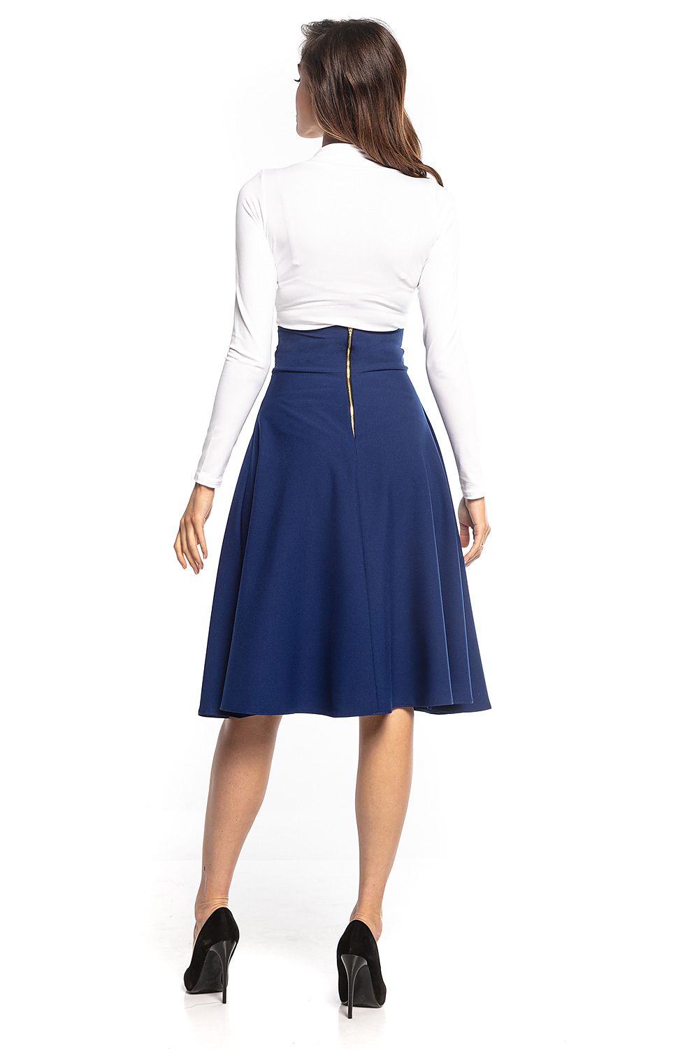 Back view of a luxurious blue midi skirt by Tessita with decorative zipper detail, paired with a chic white top and sophisticated heels.