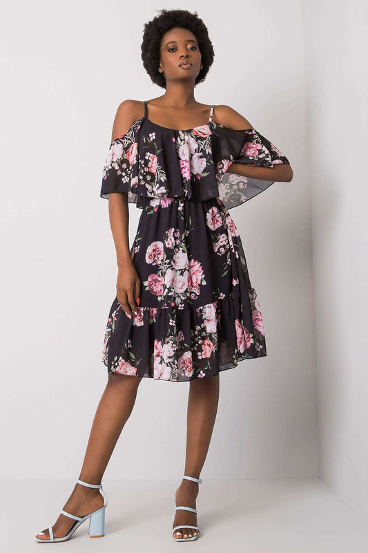 Elegant figure wearing the Och Bella Floral Strapless Daydress with Frill - Elegant Flared Cut, perfect for any occasion. The dress displays a beautiful floral print and a stylish flared design, ideal for summer outings and special events.