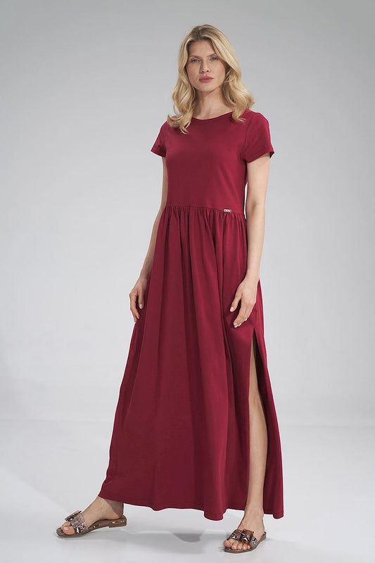 Luxury Figl Summer Cotton Maxi Dress highlighted by a pleated waist, unique slit detail, and short sleeves, elegantly displayed on a model.