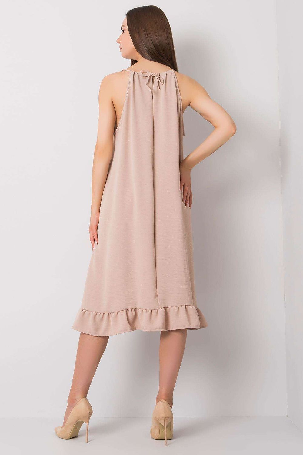 Elegant Cotton Summer Dress with Shoulder Straps and Frill Hem, showcasing a luxurious design and soft fabric, perfect for everyday wear. The image features the back view of a model wearing the dress with a sophisticated frill hem and tied straps, exuding elegance and casual comfort.