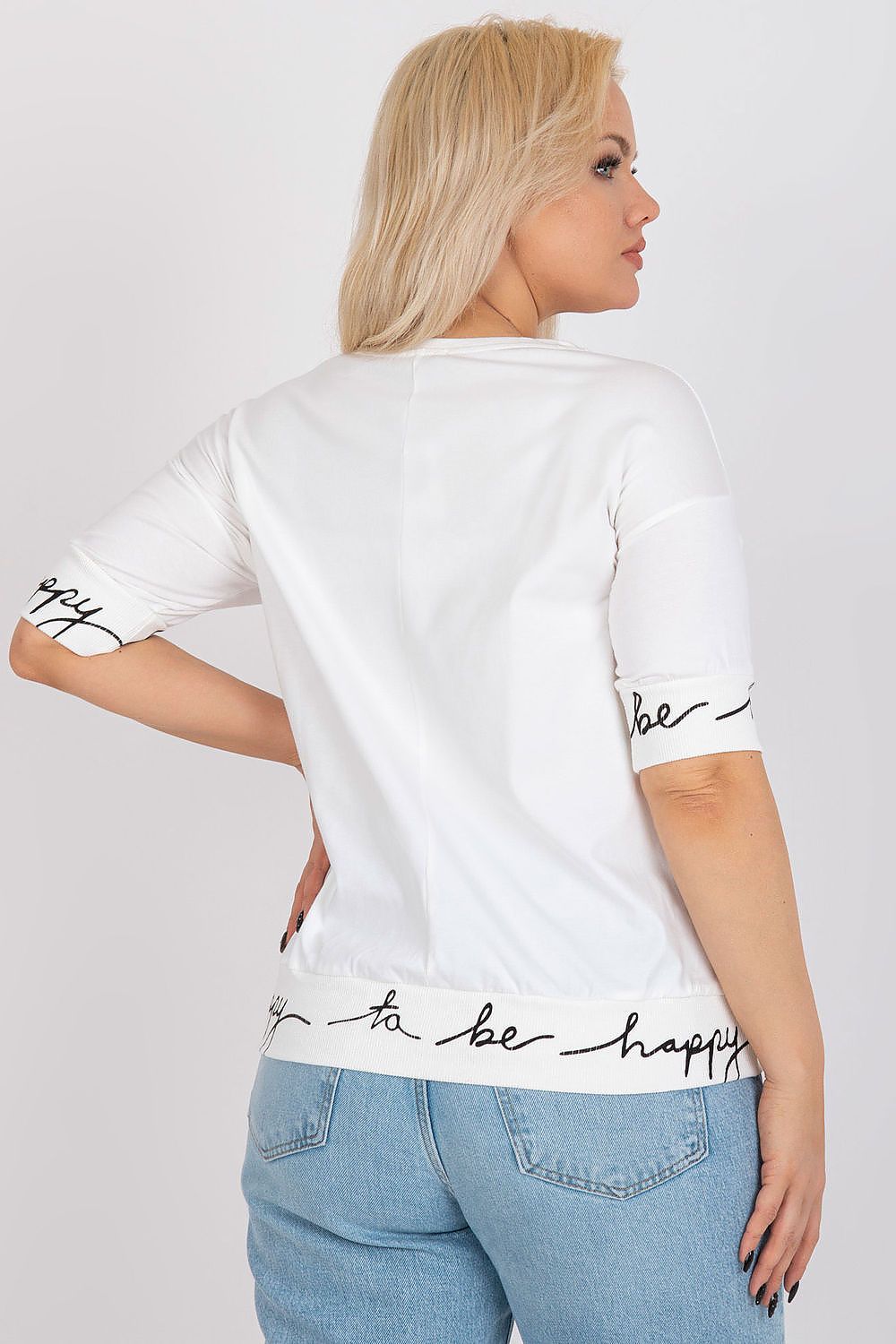 Elegant Plus Size Blouse With Short Sleeves And Decorative Inscriptions - Size EU 0, back view of the model wearing the blouse, detailing the stylish design with inscriptions, beautifully paired with stylish jeans.