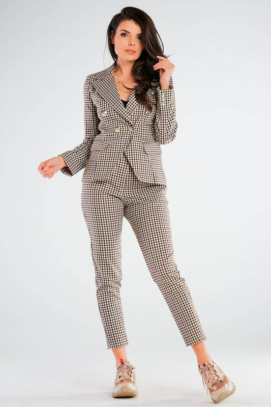 Dressed in Elegant Women's Fitted Trousers with Pockets in Unique Patterns by Awama, posing confidently in a trendy office ensemble.