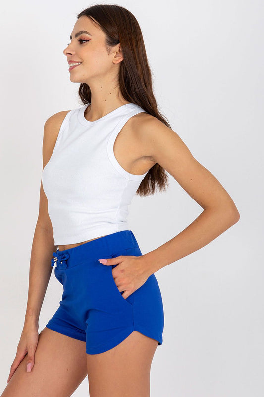 High-Waisted Cotton Spandex Sweatshorts with Drawstring and Slip-On Pockets - BFG model seen in profile, displaying the chic design of blue sweatshorts paired with a white tank top.