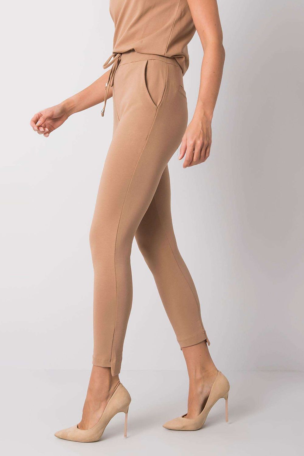 Side view of BFG Luxury Tapered Sweatpants with Adjustable Waist and Side Pockets in a classy beige, highlighting the tailored fit and luxury materials.