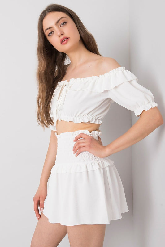 Och Bella Spanish Style Blouse with Tie Front and Short Sleeves - Elegant Polyester Top displayed on a model presenting a stylish side angle, showcasing the ruffled sleeve detail.
