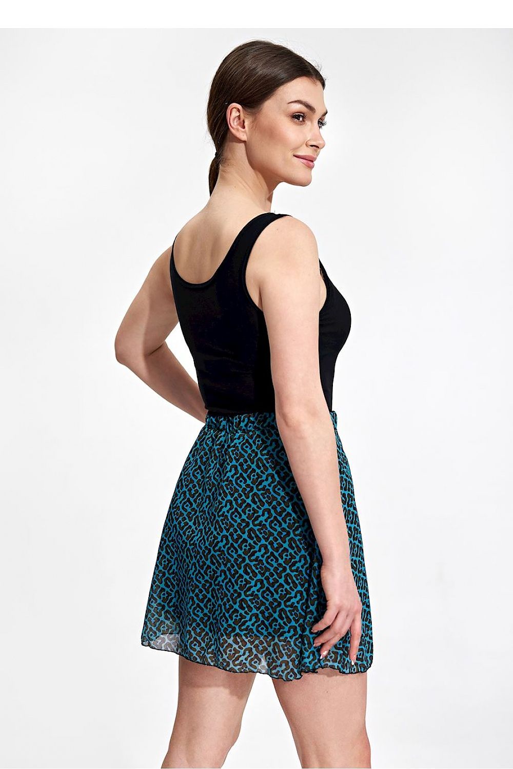 Rear view of the Flared Mini Skirt by Figl, highlighting the intricate pattern and elastic waistband, perfect for a stylish and elegant look.