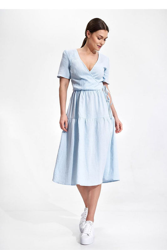 Elegant Figl Summer Midi Dress with Short Sleeves and Flared Cut in 100% Cotton, showcased by a model in a light blue dress, highlighting its stylish design and relaxed fit.