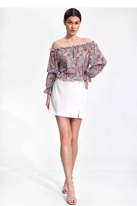 Elegantly Airy Figl Long Sleeve Blouse with Elastic Bands - Stylish side view of a model in a floral off-shoulder blouse and white skirt, radiating elegance and sophistication.