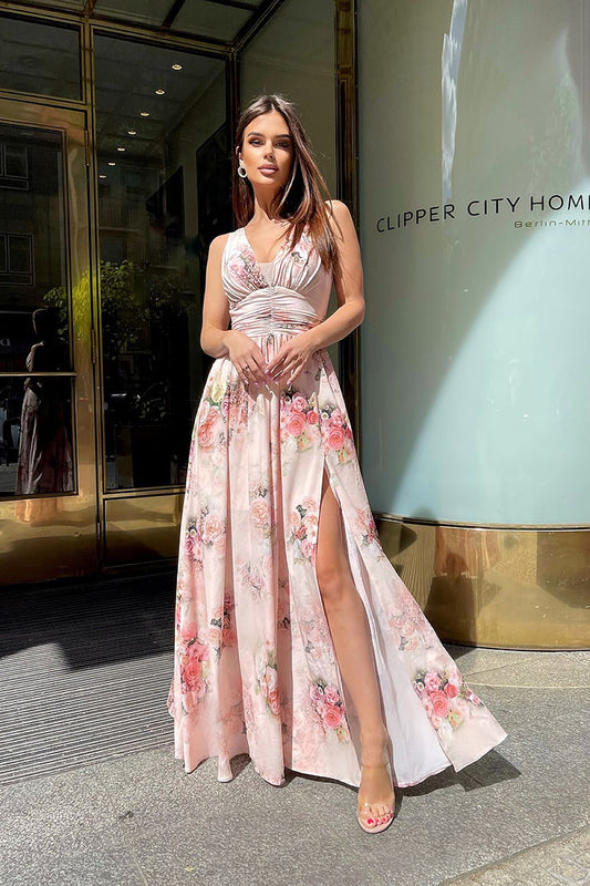 Elegant Floral Long Dress by Bicotone with Slit and Delicate Neckline for Summer Occasions, featuring a close-up of a model elegantly posing in a luxurious floral dress with a delicate neckline, ideal for summer celebrations.