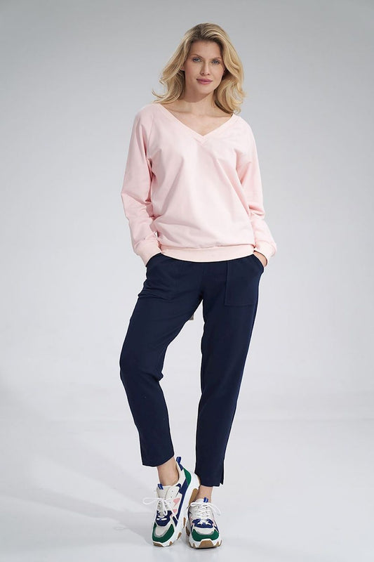 Luxury Figl Cotton V-Neck Sweatshirt with Ribbed Hem and Decorative Ribbon, styled with navy trousers, showcasing the elegant pink hue and relaxed silhouette.