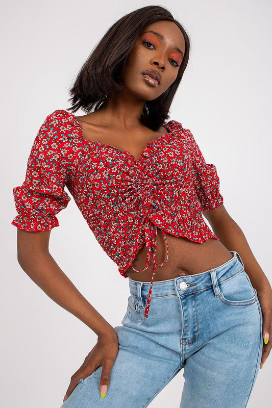 Chic and fashionable, the fitted short sleeve v-neck blouse in 100% viscose by Rue Paris showcases a stunning red floral design, ideal for a luxurious casual look.