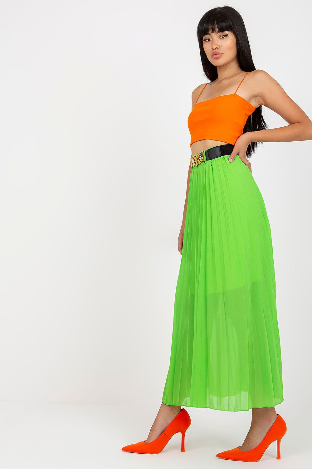 Elegant Long Skirt with Elastic Waistband and Decorative Chain Belt by Italy Moda, styled with a vibrant orange crop top and eye-catching orange high heels, showcasing a chic and luxurious look.