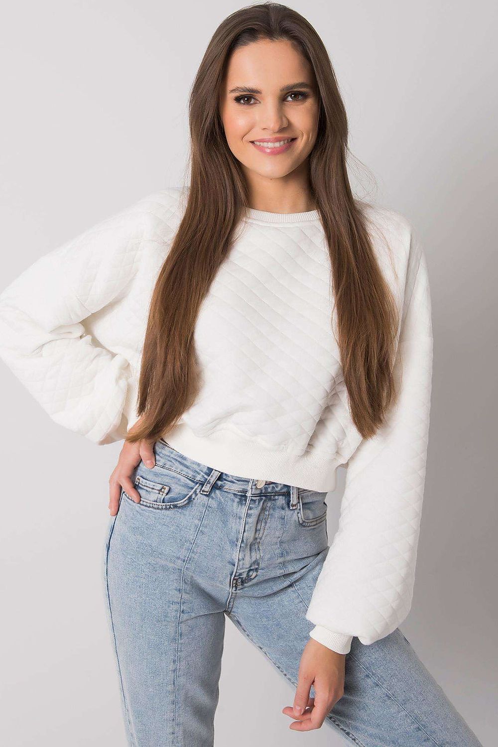 Elegant BFG Quilted Fabric Sweatshirt with Ribbed Hem – Long Sleeves, Perfect for Casual Chic, a vibrant white sweatshirt complemented by high-waisted jeans, enhancing its luxe appeal.